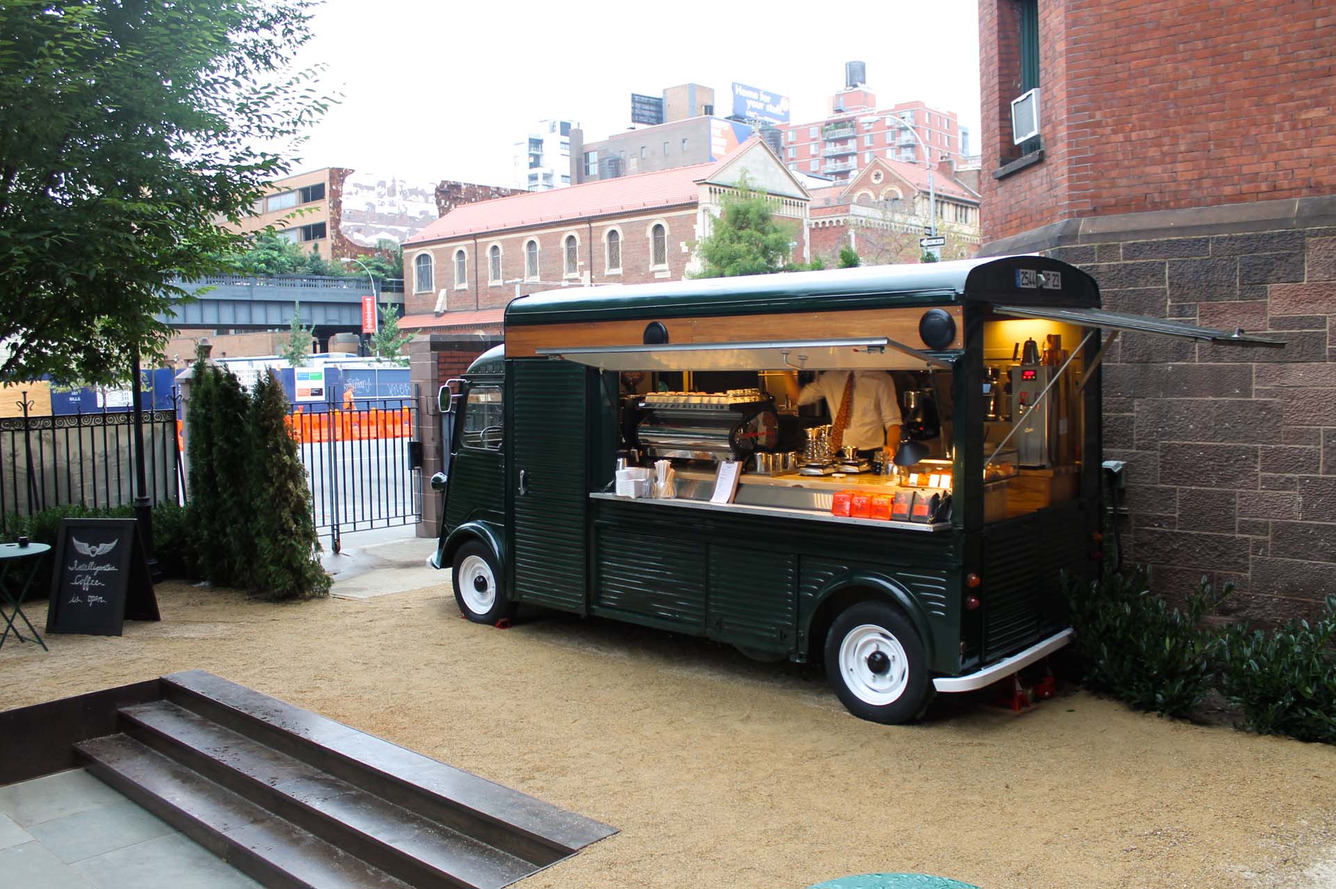 While not as crazy as a giant, pig-shaped truck, Intelligentsia scores big points for fitting into its environment, hip, trendy downtown Manhattan, serving up coffee just outside the swank High Line Hotel at the corner of 10<sup>th</sup> Ave and 20<sup>th</sup> St. Starting with a 1967 Citroen HY Van, its designers retrofitted the interior to house a full barista bar and service counter. And painted it black, of course.