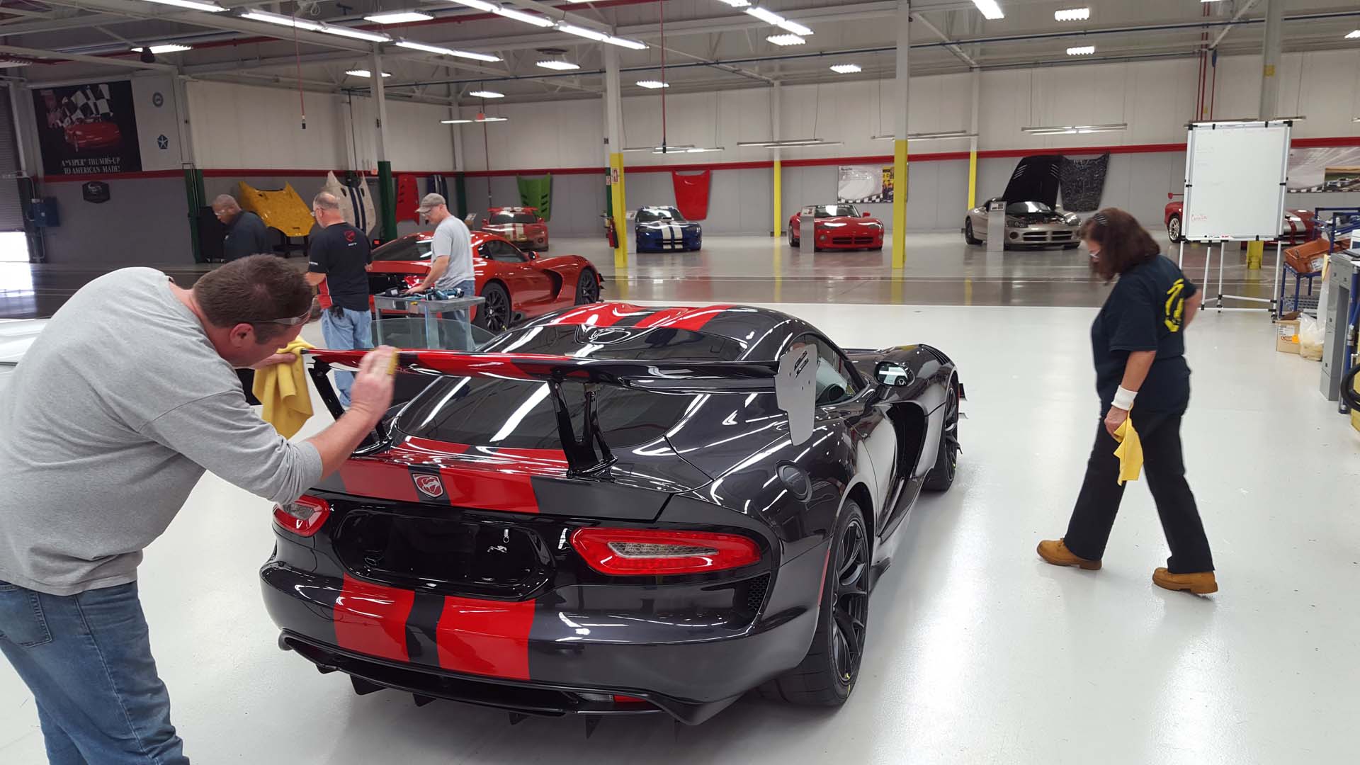 Every Viper is different, and they’re all flawless. In this photo, Steven Showalter and Bonnie Marth give a new Viper ACR a close-up inspection. This pair works at Prefix, the company who paints and preps all of the Viper’s body panels. They spend their day at Conner Avenue though, working under this flaw-revealing lighting and inspecting the paint and finish for any imperfections, no matter how small. In this photo, Showalter is making a final hand-buff of the rear spoiler, which he just finished re-buffing to remove some ‘orange peel’ in the paint.